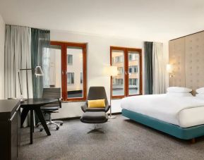 King bedroom with desk at the Hilton Stockholm Slussen.