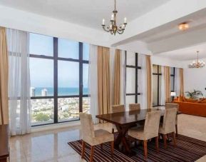 Living room with sofas, tables and chairs at the Hilton Colombo Residence.