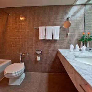 clean and spacious king bathroom with shower and bath combo at Hilton Addis Ababa.