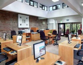 dedicated business center and workspace with PCs, internet, printers, and business desks at Hilton Addis Ababa.