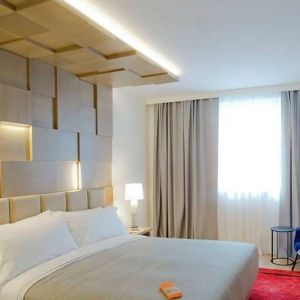 delux king room with TV, work desk, and chair at Canopy by Hilton Zagreb City Centre.