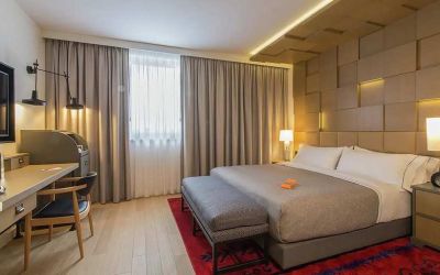 lovely king room with TV, work desk, and chair at Canopy by Hilton Zagreb City Centre.