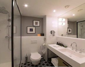 clean and spacious bathroom with shower at Canopy by Hilton Zagreb City Centre.