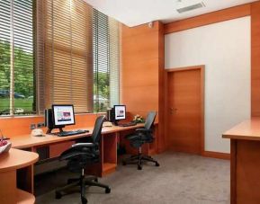 dedicated business center with PC, internet, desk, chair, and printer ideal for working remotely at DoubleTree by Hilton Luxembourg.