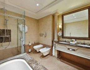 clean and spacious king bathroom with shower and bath at Hilton Beirut Habtoor Grand.