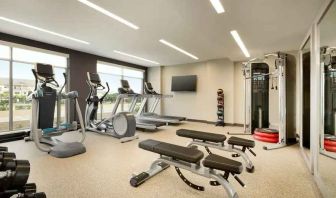 Fitness center with machines at Embassy Suites by Hilton Oahu Kapolei.
