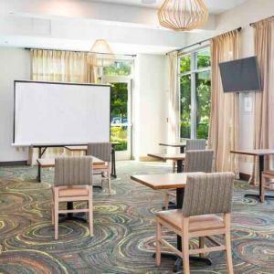 Bright meeting room with large windows at Embassy Suites by Hilton Oahu Kapolei.
