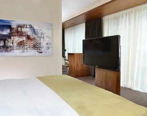 comfortable king room with TV at DoubleTree by Hilton Zagreb.