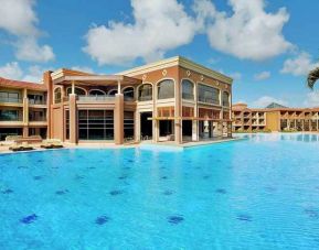 stunning outdoor pool with sunbeds at Hilton Alexandria King's Ranch.