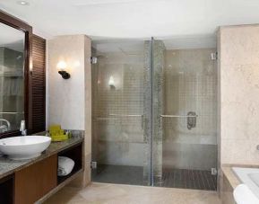 clean and spacious king bathroom with shower and bath at Hilton Luxor Resort & Spa.