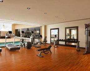 Exercise room with treadmills, free weights, weigth machines, and plenty of space to stretch out and do yoga.