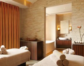 Beautiful brick-lined room with space for two massage tables, and a large view of Jaipur, India.