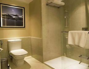 clean and spacious guest bathroom with shower at Hilton Garden Inn Trivandrum.