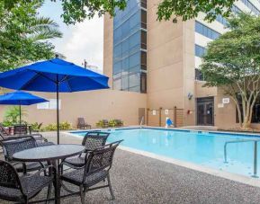 Relaxing outdoor pool area at the Doubletree by Hilton Houston Medical Center Hotel & Suites.