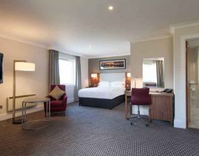Spacious hotel suite with working station at the Doubletree by Hilton Glasgow Strathclyde.