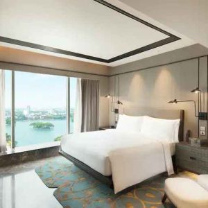 Comfortable king bedroom at the Conrad Bengaluru.