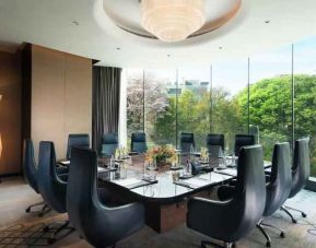 Meeting room with large window at the Conrad Bengaluru.