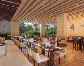 Dining area suitable for co-working at the DoubleTree by Hilton Gurugram Baani Square.