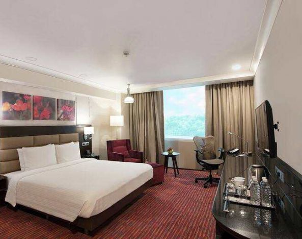 Spacious hotel room with working station at the Hilton Garden Inn New Delhi/Saket.
