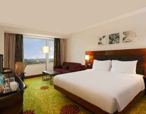 King bedroom with desk at the Hilton Garden Inn New Delhi/Saket.