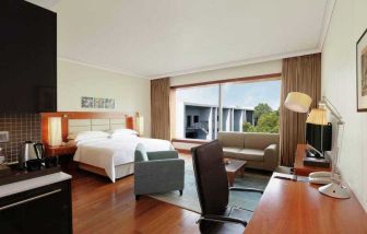 Spacious hotel room with working station at the Hilton Bangalore Embassy GolfLinks.