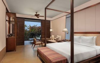 King bedroom with desk at the Hilton Goa Resort.