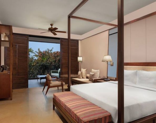 King bedroom with desk at the Hilton Goa Resort.