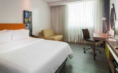King bedroom with desk at the Hampton by Hilton Cartagena.