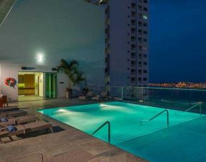 Relaxing outdoor pool at the Hampton by Hilton Cartagena.