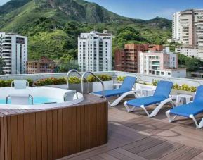 Outdoor terrace with pool at the Hampton by Hilton Cali.