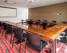 Meeting room with u shape table at the Hampton by Hilton Cali.