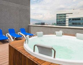 Outdoor terrace with pool at the Hampton by Hilton Medellin Antioquia.