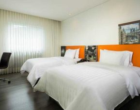 Twin room with working station at the Hampton by Hilton Medellin Antioquia.