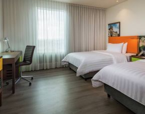 Twin room with working station at the Hampton by Hilton Bogota Airport.