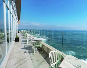 Outdoor terrace overlooking the ocean perfect as workspace at the Hampton by Hilton Antofagasta.