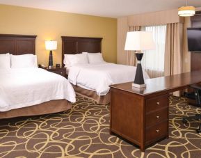 Twin room with working station at the Hampton Inn Omaha Midtown-Aksarben Area.