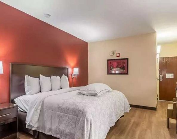 Spacious delux king bedroom at Red Roof PLUS+ & Suites Houston - IAH Airport SW.