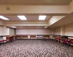 Quiet meeting room ideal for working remotely or for business meetings at Red Roof PLUS+ & Suites Houston - IAH Airport SW.