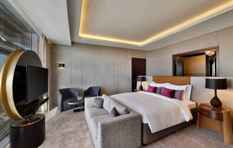 King bedroom at the AlRayyan Hotel Doha, Curio Collection by Hilton.