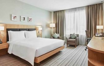 Bright king bedroom with desk at the Hilton Garden Inn Erzurum.