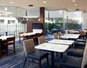 Dining area perfect for co-working at Courtyard By Marriott Los Angeles LAX/Century Boulevard.