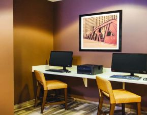 Business center with computers and printer at La Quinta Inn & Suites By Wyndham Chicago Downtown.