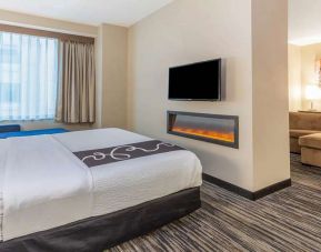 Hotel suite with fireplace and TV screen at La Quinta Inn & Suites By Wyndham Chicago Downtown.