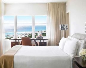 King bedroom with working station overlooking the water at Shelborne South Beach.