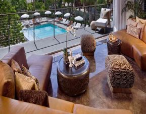 Beautiful living room overlooking the pool area at SLS South Beach.