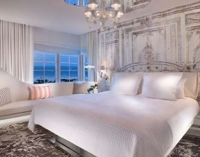 Elegant hotel room with sofa at SLS South Beach.