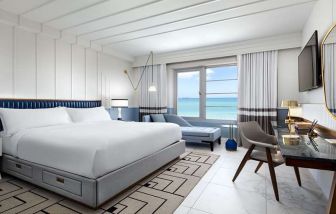 King bedroom with workstation at Cadillac Hotel & Beach Club, Autograph Collection.