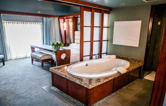 King bedroom with bathtub at Shade Hotel Manhattan Beach.