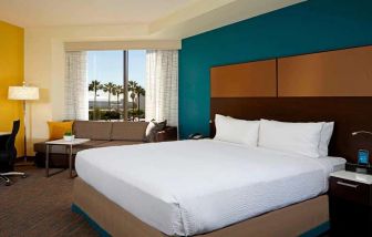 King bedroom with workstation at Residence Inn By Marriott LAX Airport.