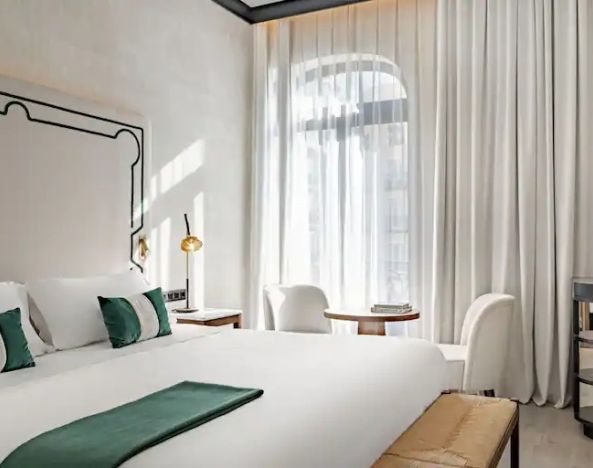 Bright king bedroom at the Hotel Montera Madrid, Curio Collection by Hilton.
